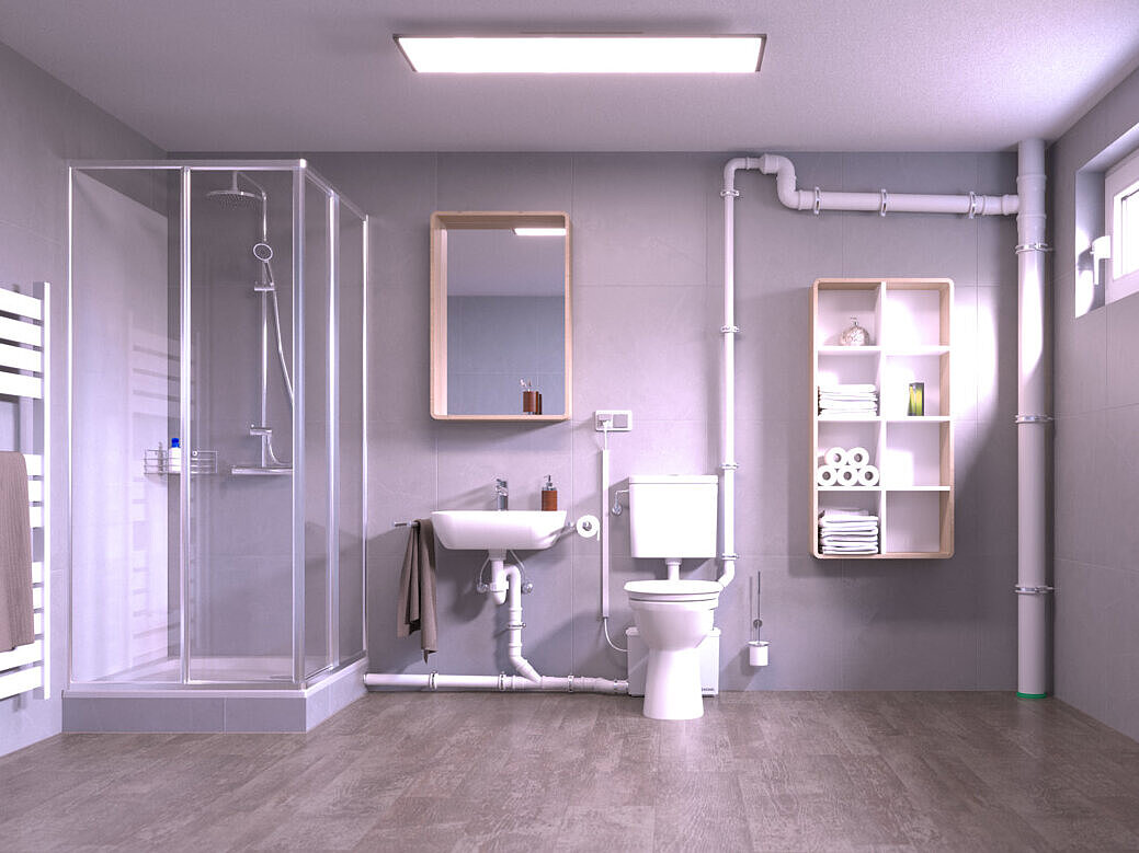 Installation diagram for the Minilift M small lifting station WC A basement room with a retrofitted toilet and a shower, which are drained via a small lifting station located behind the toilet.